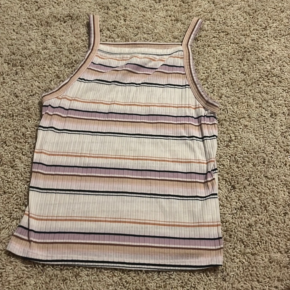 Color pattern of light purple, black, Tan, pink, light orange.